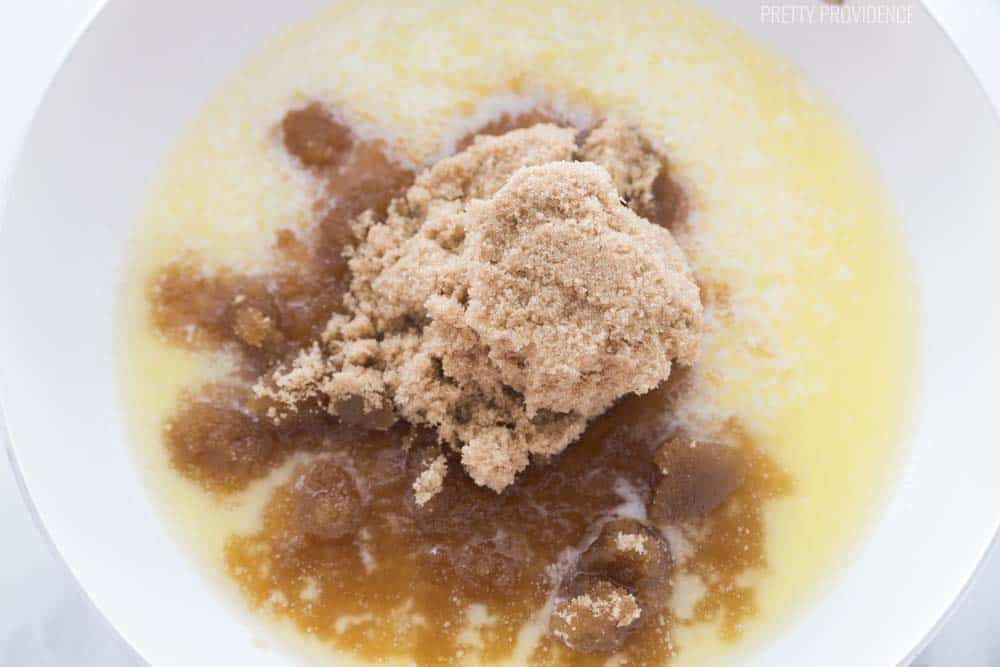 butter, brown sugar, karo syrup and sweetened condensed milk in a pot on the stove