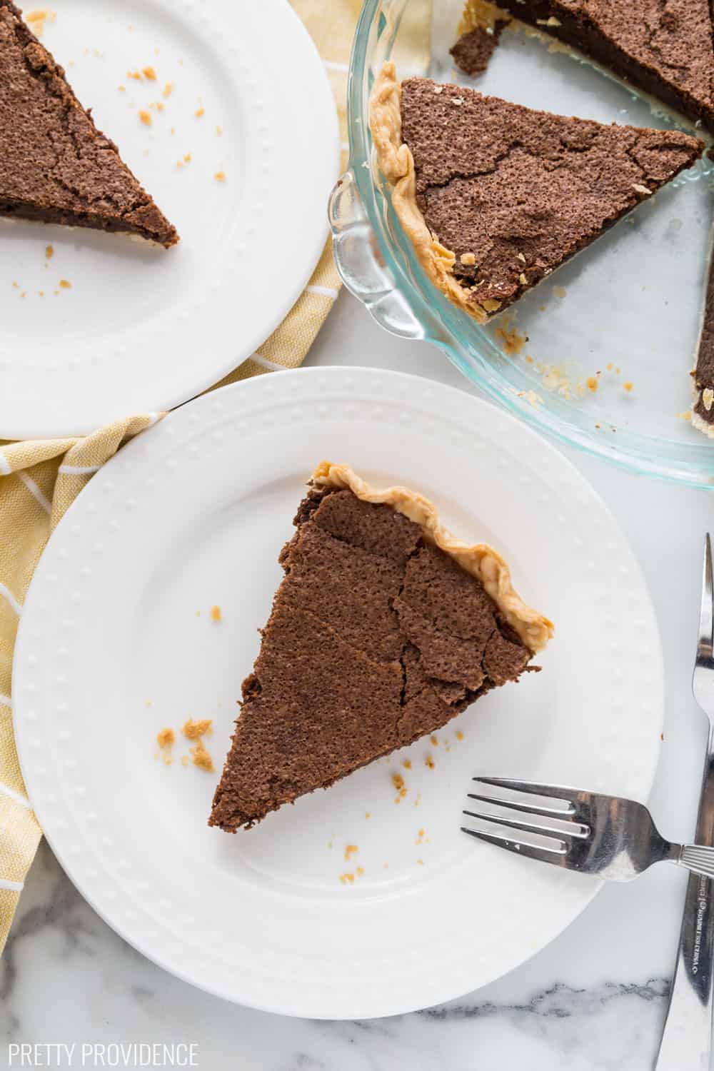 Chocolate Chess Pie slices on white dessert plates.
