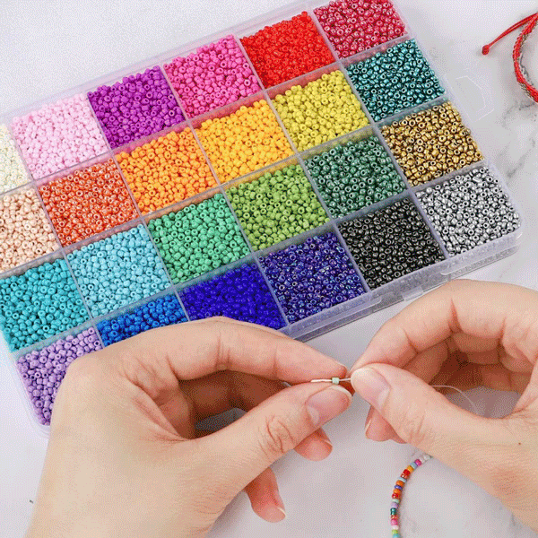 Seed beads in many colors in an organizer.